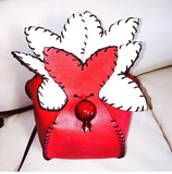 Vann's signature cross-body mini pom bag©